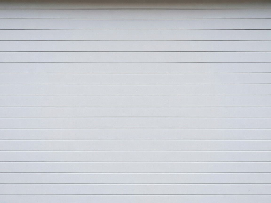 White sectional garage door showing horizontal panels